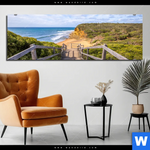 Bild Edelstahloptik Holztreppe Zum Einsamen Strand Panorama Produktvorschau mit dem Bild Holztreppe zum einsamen Strand im Format Panorama.