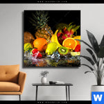Leinwandbild Obst In Spritzendem Wasser Quadrat Produktvorschau mit dem Bild Obst-in spritzendem Wasser im Format Quadrat.
