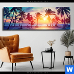 Leinwandbild Palmen Bei Sonnenuntergang Panorama Produktvorschau mit dem Bild Palmen bei Sonnenuntergang im Format Panorama.
