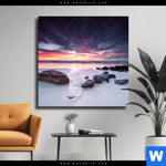 Leinwandbild Sonnenaufgang Am Strand Mit Felsen Quadrat Produktvorschau mit dem Bild Sonnenaufgang am Strand mit Felsen im Format Quadrat.