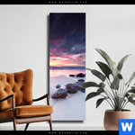 Leinwandbild Sonnenaufgang Am Strand Mit Felsen Schmal Produktvorschau mit dem Bild Sonnenaufgang am Strand mit Felsen im Format Schmal.