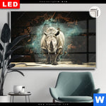Leuchtbild Dia Nashorn Zerstoert Wand Querformat Produktvorschau mit dem Bild Nashorn zerstört Wand im Format Querformat.