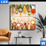 Leuchtbild Gewuerze Auf Hoelzernen Loeffeln Quadrat Produktvorschau mit dem Bild Gewürze auf hölzernen Löffeln im Format Quadrat.