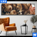 Leuchtbild Loewe Schlaeft In Blueten Panorama Produktvorschau mit dem Bild Löwe schläft in Blüten im Format Panorama.