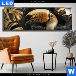 Leuchtbild Monstera Und Tukan Gold Panorama Produktvorschau mit dem Bild Monstera und Tukan Gold im Format Panorama.