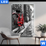 Leuchtbild Rotes Fahrrad In Gasse Hochformat Produktvorschau mit dem Bild Rotes Fahrrad in Gasse im Format Hochformat.