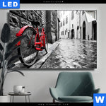 Leuchtbild Rotes Fahrrad In Gasse Querformat Produktvorschau mit dem Bild Rotes Fahrrad in Gasse im Format Querformat.