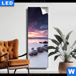 Leuchtbild Sonnenaufgang Am Strand Mit Felsen Schmal Produktvorschau mit dem Bild Sonnenaufgang am Strand mit Felsen im Format Schmal.