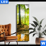 Leuchtbild Wald Mit Sonnenstrahlen Schmal Produktvorschau mit dem Bild Wald mit Sonnenstrahlen im Format Schmal.