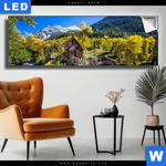 Leuchtbild Waldhuette Am Fluss Panorama Produktvorschau mit dem Bild Waldhütte am Fluss im Format Panorama.