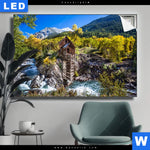 Leuchtbild Waldhuette Am Fluss Querformat Produktvorschau mit dem Bild Waldhütte am Fluss im Format Querformat.