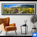 Poster Waldhuette Am Fluss Panorama Produktvorschau mit dem Bild Waldhütte am Fluss im Format Panorama.