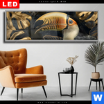 Wechselmotiv Dia Monstera Und Tukan Gold Panorama Produktvorschau mit dem Bild Monstera und Tukan Gold im Format Panorama.