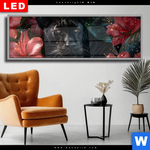 Wechselmotiv Dia Panther Und Rote Blueten Panorama Produktvorschau mit dem Bild Panther und rote Blüten im Format Panorama.