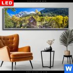 Wechselmotiv Dia Waldhuette Am Fluss Panorama Produktvorschau mit dem Bild Waldhütte am Fluss im Format Panorama.