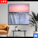 Wechselmotiv Dia Wasserfall Bei Abendroete Quadrat Produktvorschau mit dem Bild Wasserfall bei Abendröte im Format Quadrat.