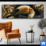 Wechselmotiv Monstera Und Tukan Gold Panorama Produktvorschau mit dem Bild Monstera und Tukan Gold im Format Panorama.