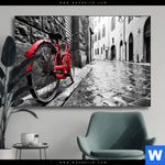 Wechselmotiv Rotes Fahrrad In Gasse Querformat Produktvorschau mit dem Bild Rotes Fahrrad in Gasse im Format Querformat.