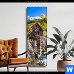 Wechselmotiv Waldhuette Am Fluss Schmal Produktvorschau mit dem Bild Waldhütte am Fluss im Format Schmal.