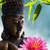 Wechselmotiv Buddha Statue mit Seerose Querformat Zoom wandbild.com