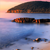 Wechselmotiv Sonnenuntergang in Bucht Querformat Zoom wandbild.com